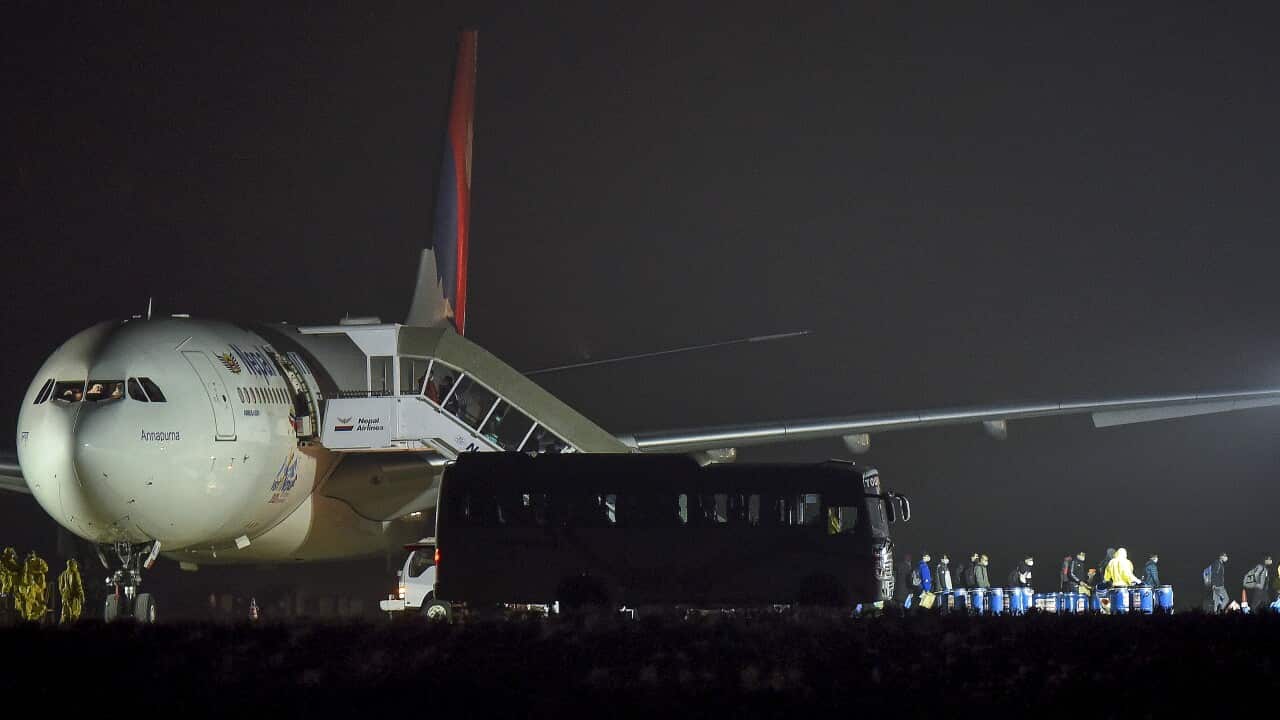 Nepalese citizens depart the Nepal Airlines after being evacuated from Wuhan, China, in Tribhuvan International Airport in Kathmandu, Nepal, 16 February 2020.