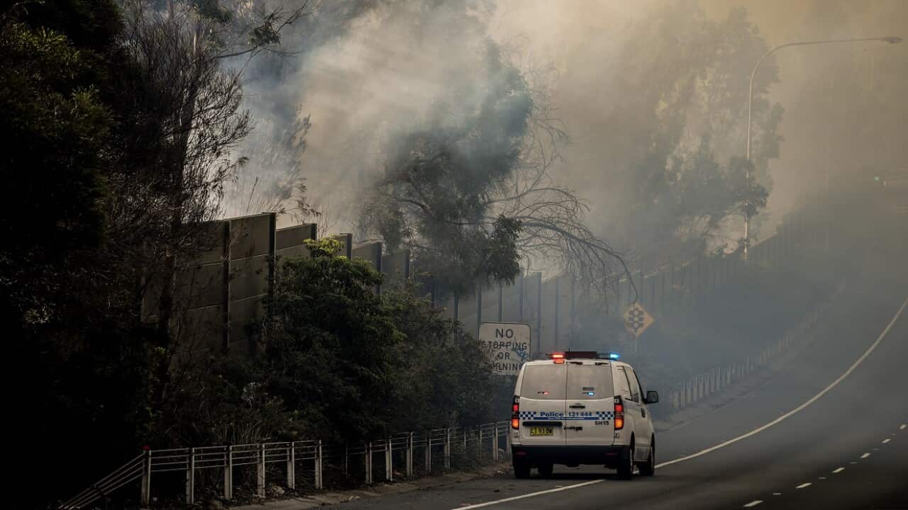Police monitor for threats to homes as a bushfire threatens properties in several suburbs on Sunday.