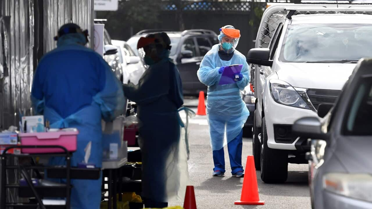 Members of the public and health workers are seen at a pop up Covid testing clinic at the Blacktown Showgrounds in the western suburbs of Sydney, July 24. 