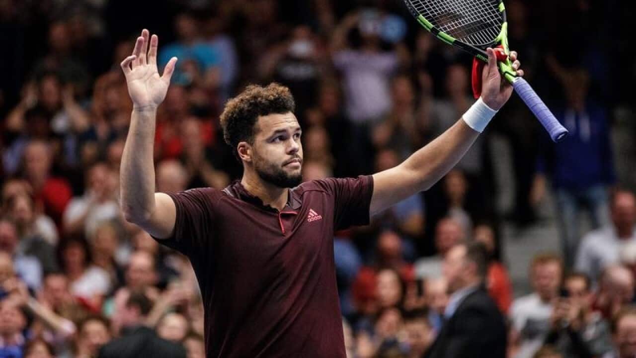 Jo-Wilfried Tsonga of France reacts after winning a game