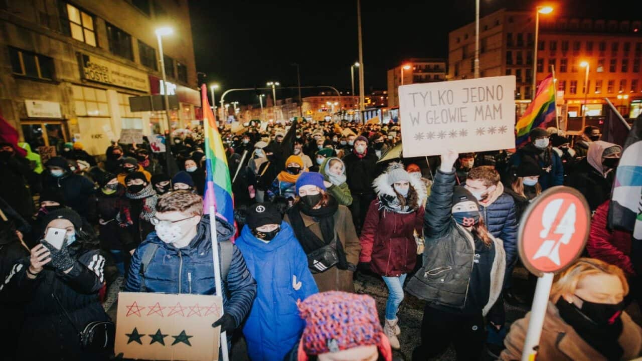 People take part in a protest against the abortion ban in Warsaw, Poland, on 27 January.