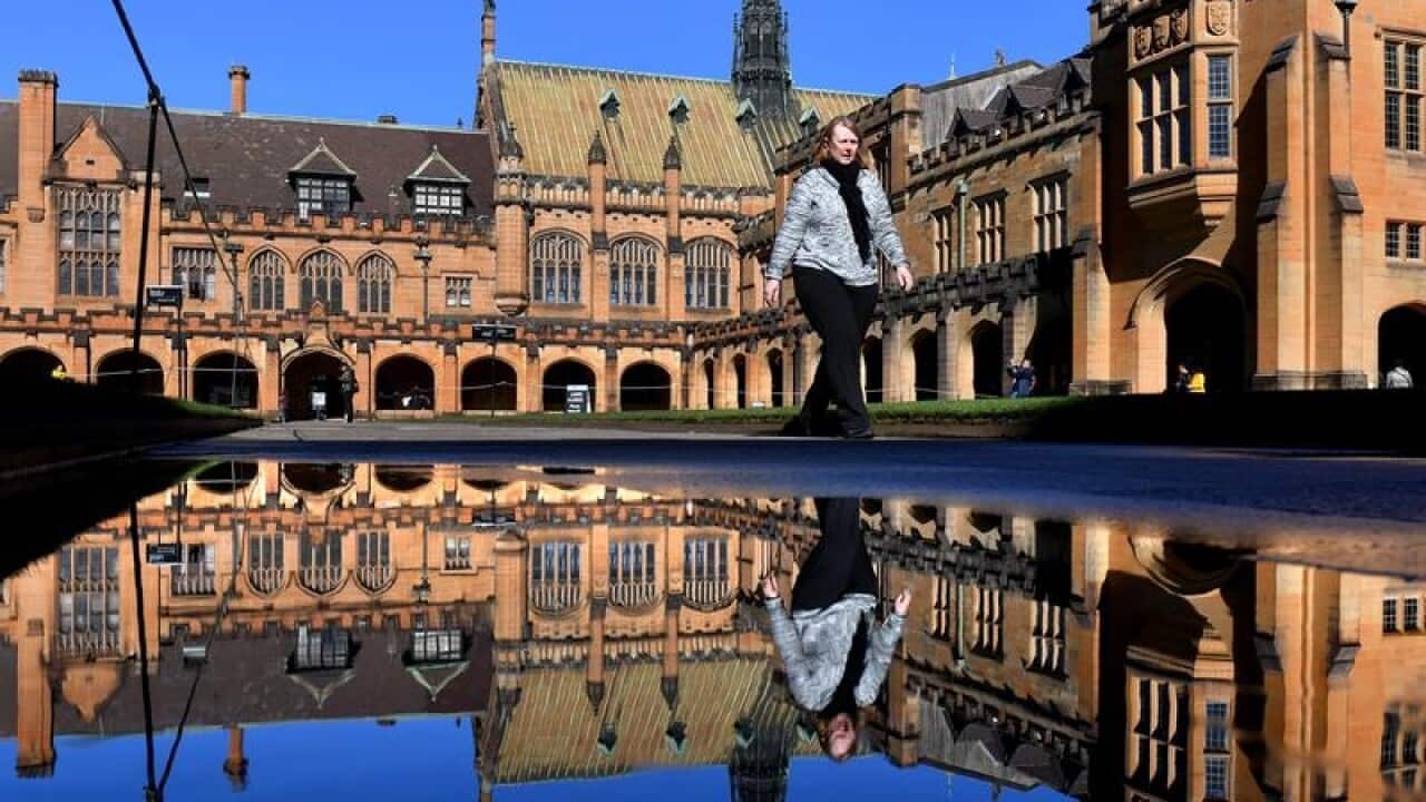 Person walking in Sydney University quadrangle