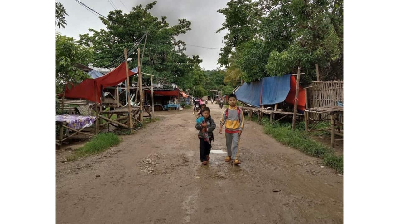 Two boys walking down on a street in Noh Poe refugee camp, Sources: WWTH