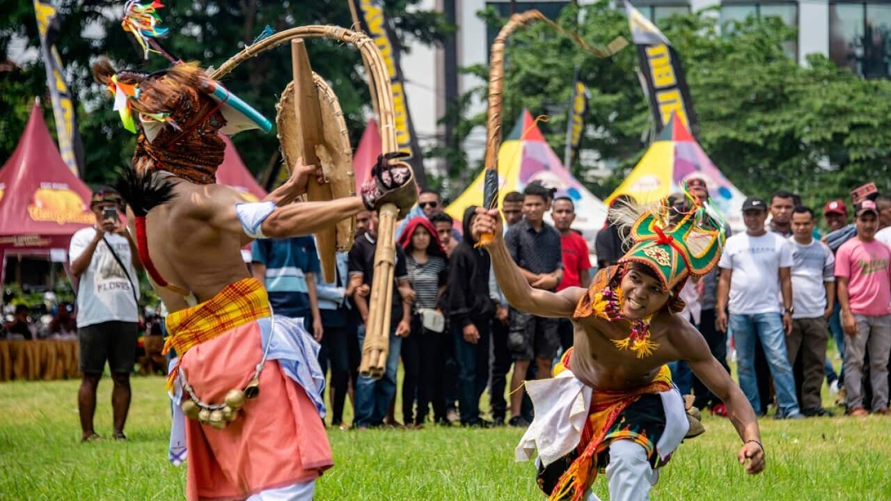 Caci fighters duel with whips in Surabaya, East Java province. 