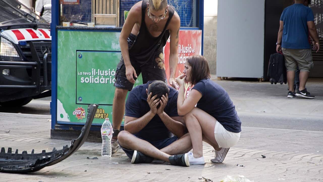 Injured people react after a van crashed into pedestrians in Las Ramblas, downtown Barcelona, Spain, 17 August 2017.