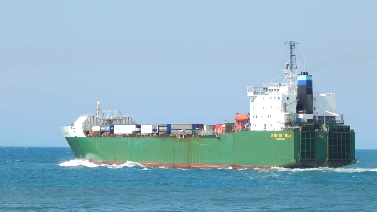 A cargo ship out on the water.