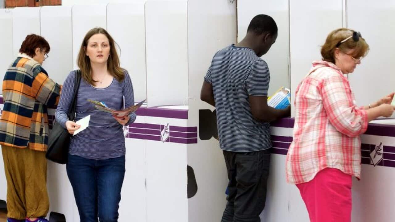 Members of the public casting their vote at Kelmscott Senior High School on election day of the Canning by election in Kelmscott, Western Australia on Saturday Sept. 19, 2015. (AAP Image/Richard Wainwright) NO ARCHIVING