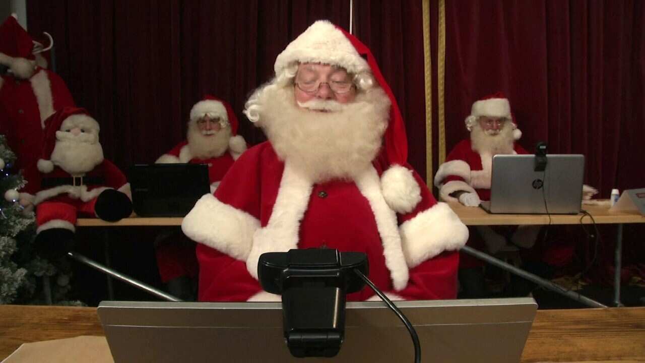 A Father Christmas performer taking a video call (AP)