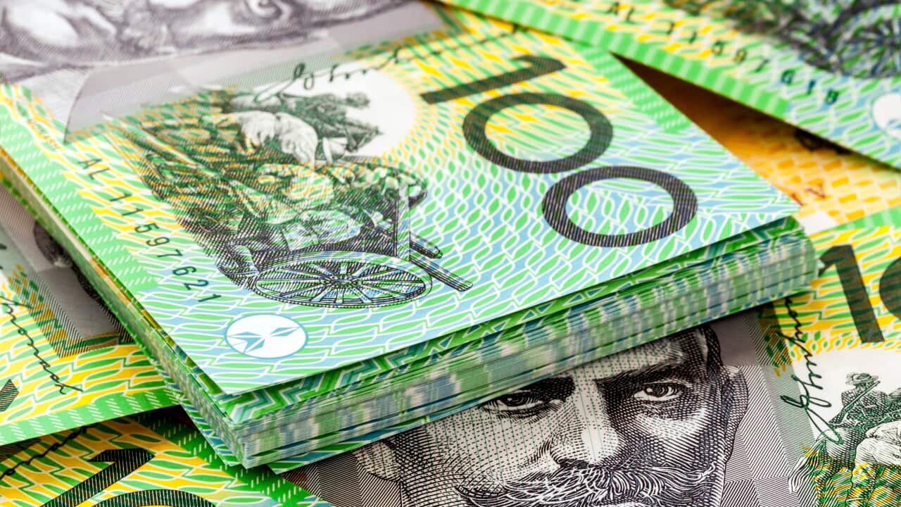 A pile of Australian $100 banknotes