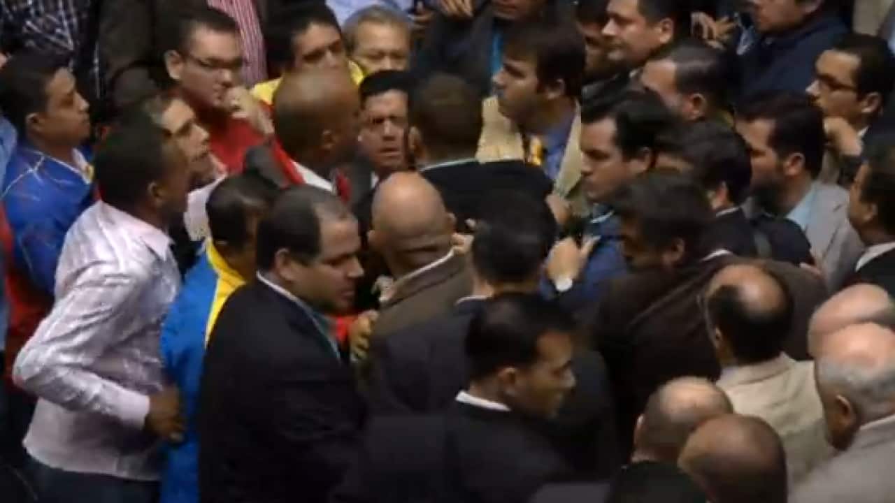 Venezuelan lawmakers scuffle on the floor of the National Assembly