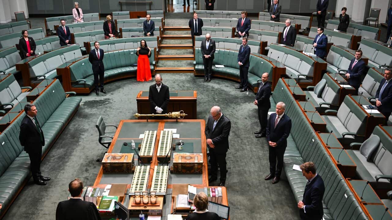 Prime Minister Scott Morrison reacts during a parliamentary sitting under rules of social distancing at Parliament House in Canberra.
