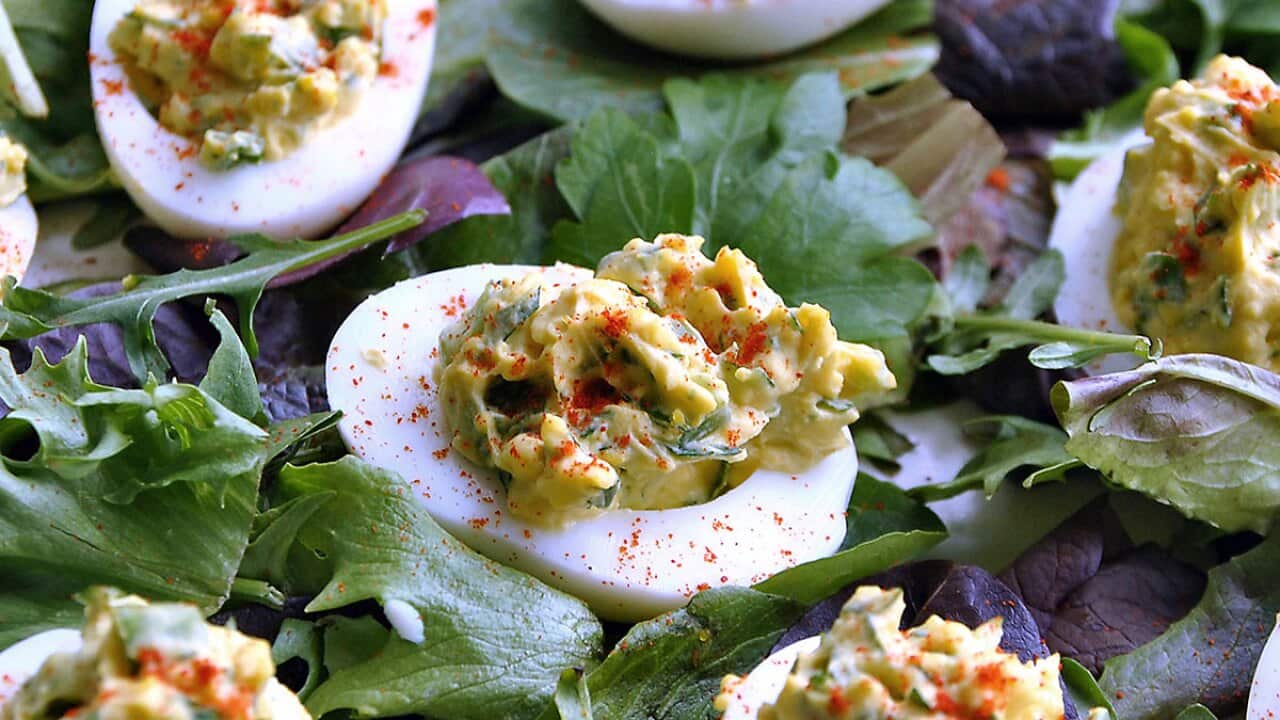 Devilled eggs with parsley, spring onion and jalapeno