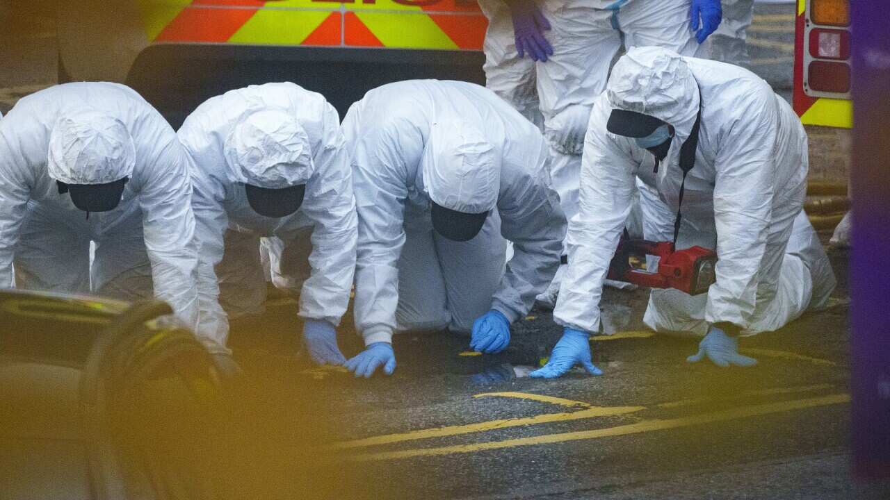 Police and forensic officers carry out a fingertip search at Liverpool Women’s hospital