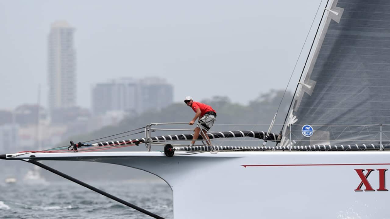 A crewman on Wild Oats XI during the Bib Boat Challenge
