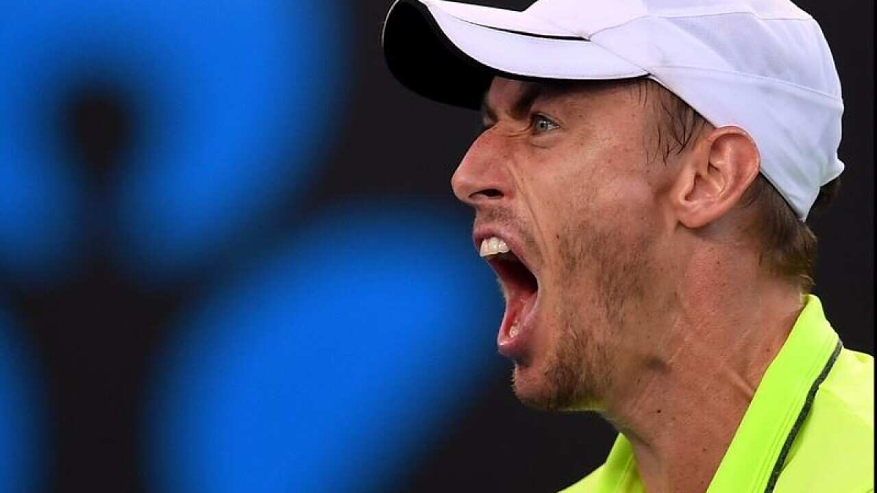 John Millman of Australia reacts to his win over Borna Coric.