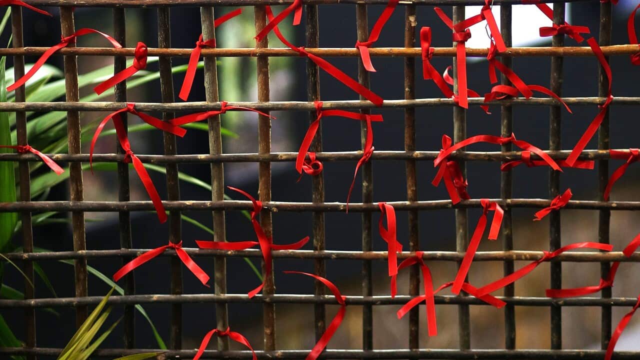 red ribbons at AIDS conference