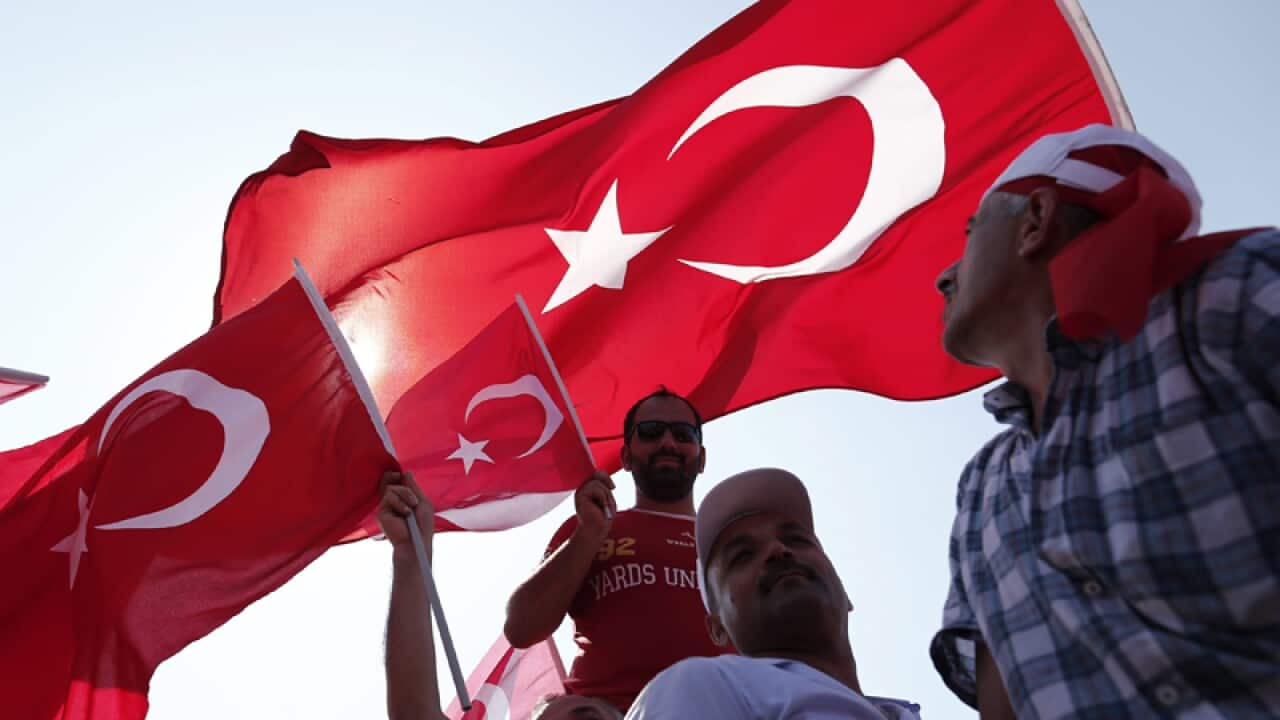 Turkish citizens fly flags