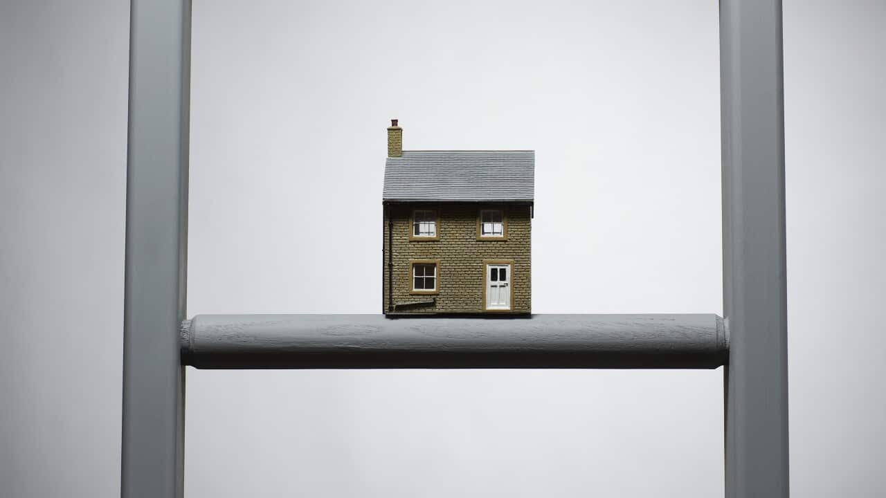 Small model of house on ladder. (AAP)
