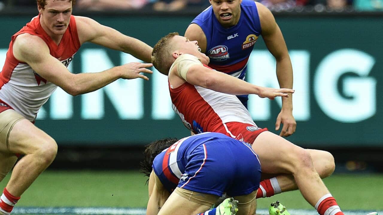 Easton Wood (third from right) of the Bulldogs and Dan Hannebery Swans