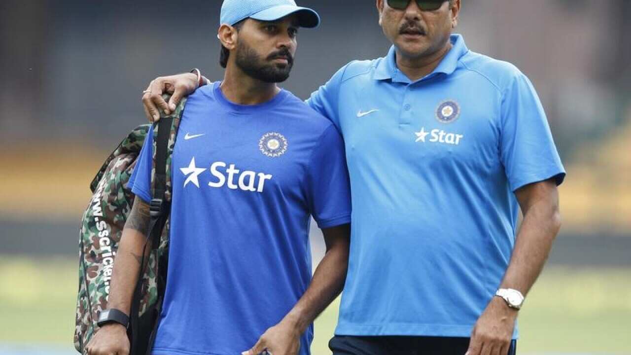 India's team director Ravi Shastri (R)