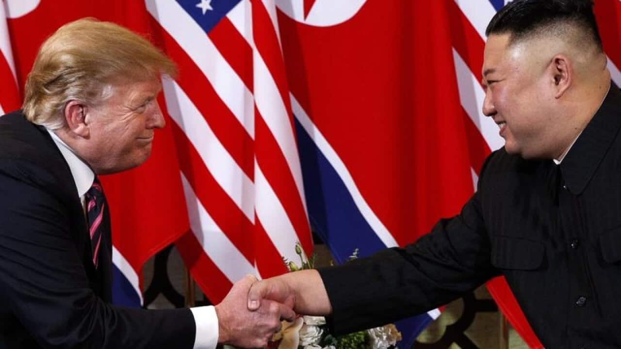 Donald Trump and Kim Jong-un shake hands in Hanoi