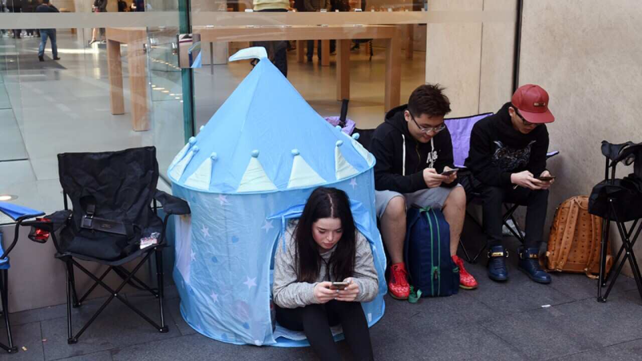 Customers outside Apple Store in Sydney