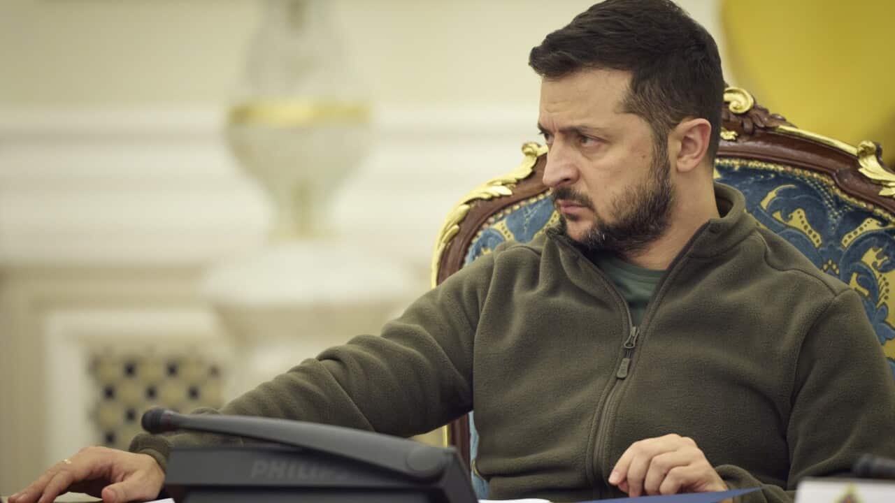 A man sitting at a desk.