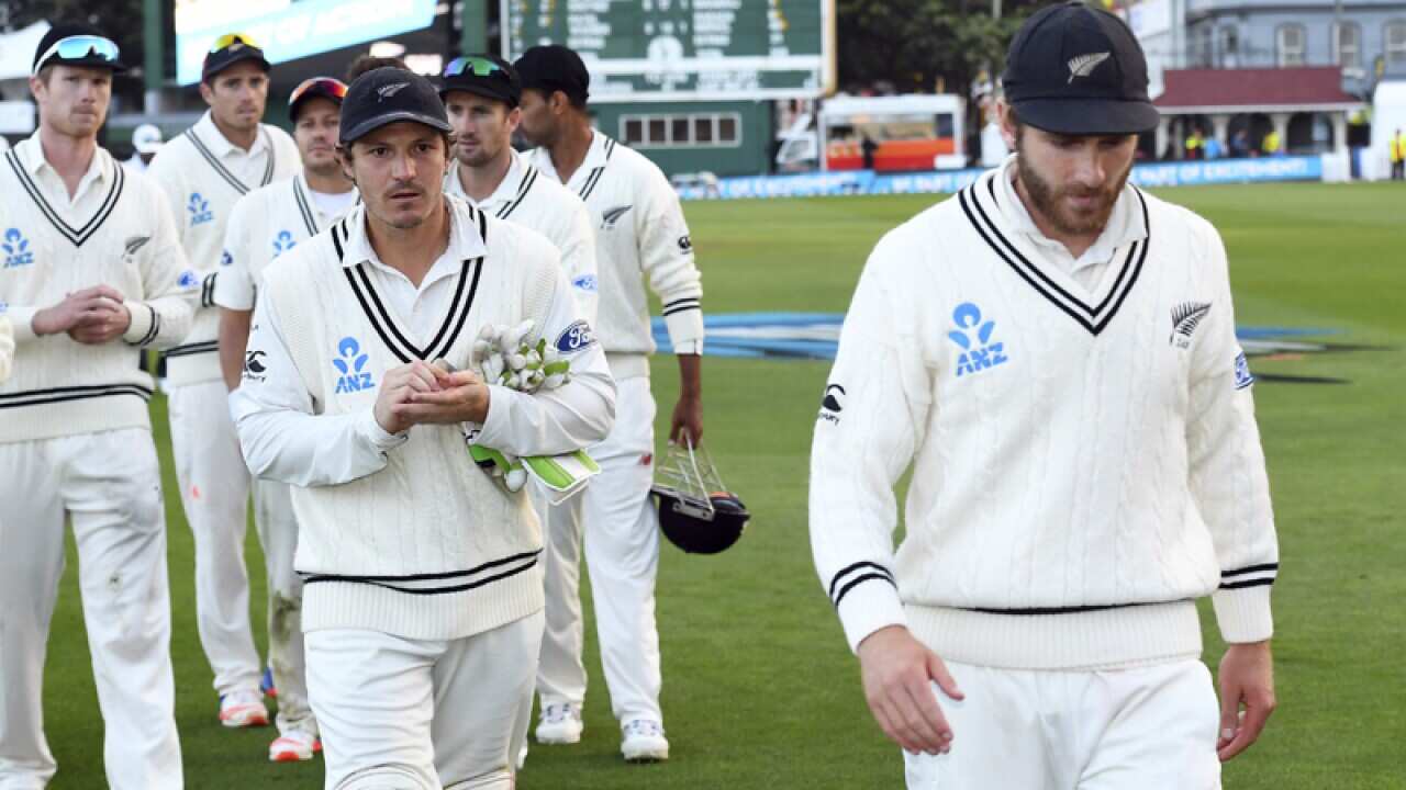 New Zealand's captain Kane Williamson leads his team off