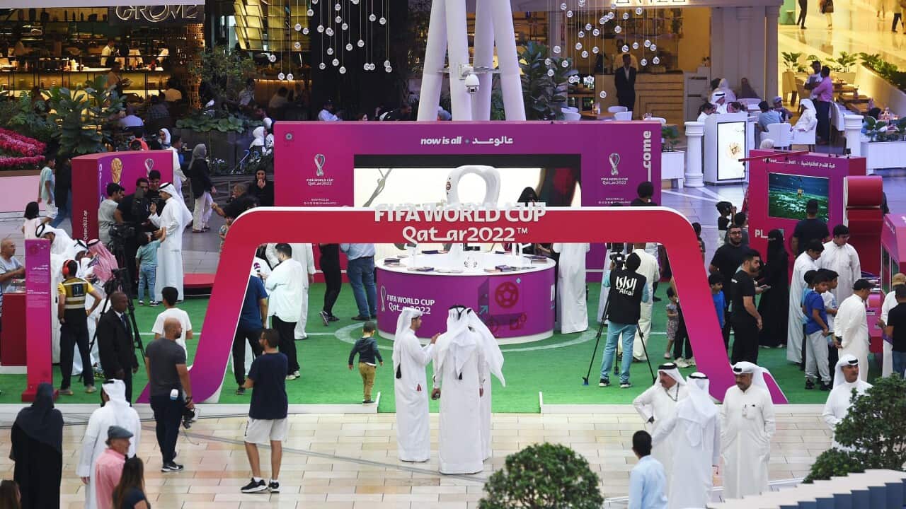 People visit an exhibition booth of the FIFA World Cup 2022 of Qatar, in Al Farwaniyah Governorate, Kuwait, on 22 September 2022.