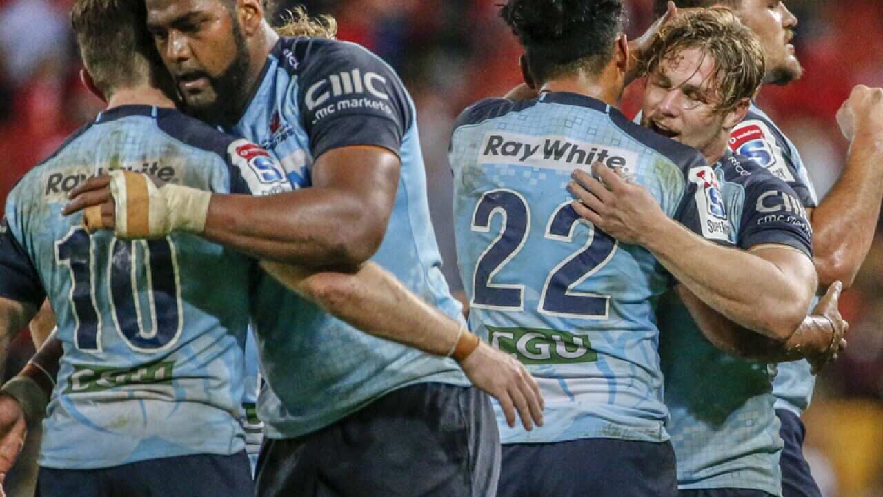 NSW Waratahs players celebrate their win
