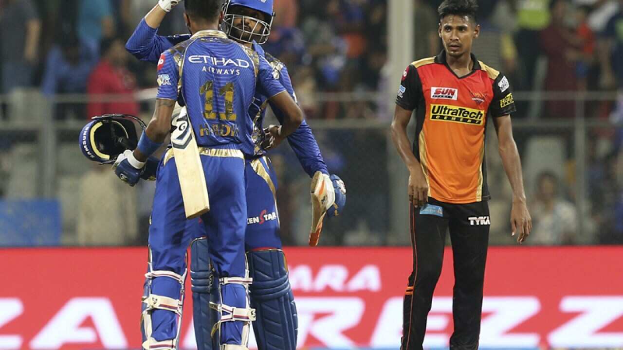 Mumbai Indians Harbhajan Singh (C) celebrates with Hardik Pandya