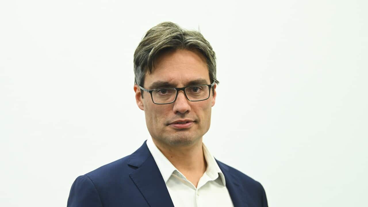 Deputy Chief Medical Officer Dr Nick Coatsworth poses for photographs at the end of a press conference at the Australian Department of Health in Canberra, Wednesday, August 19, 2020. (AAP Image/Lukas Coch) NO ARCHIVING