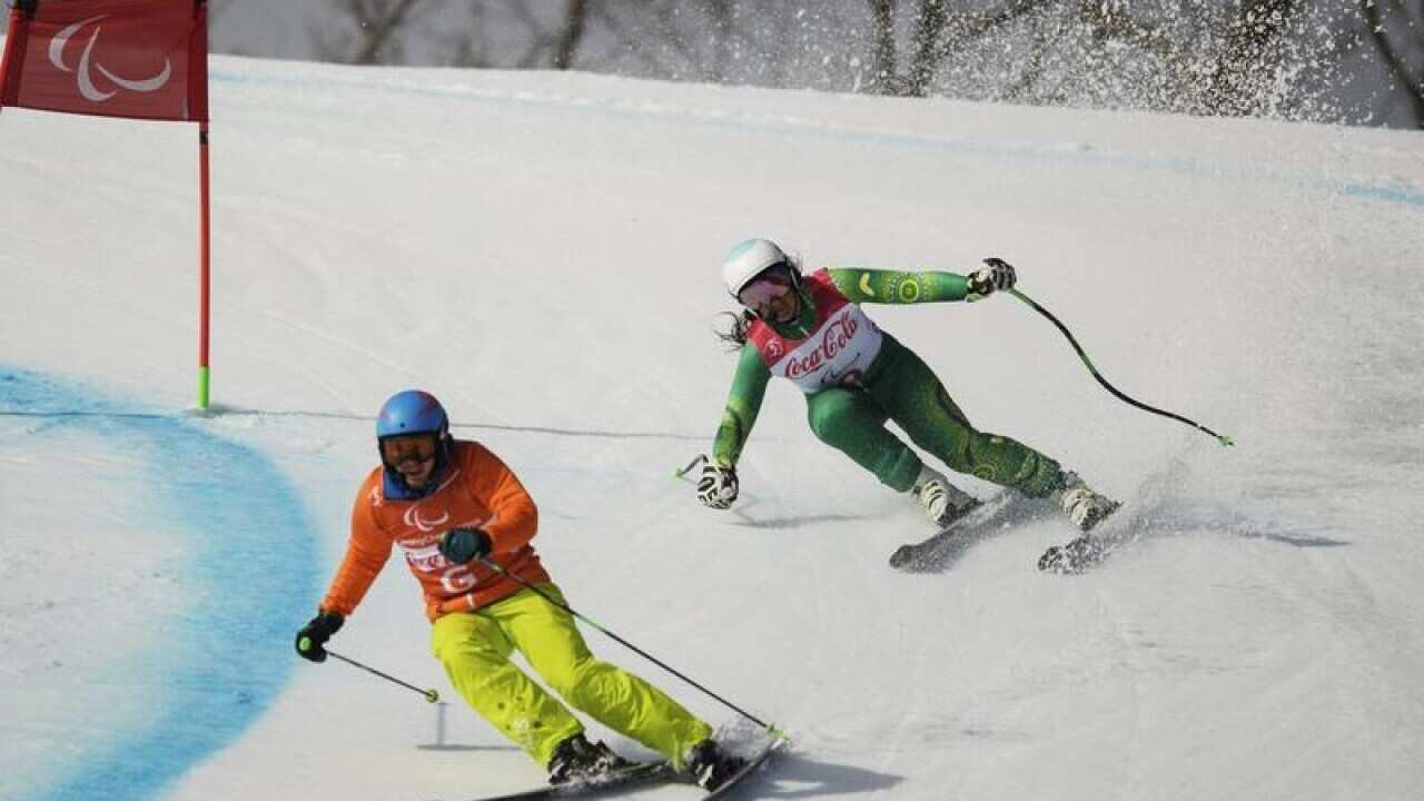 Melissa Perrine competes in the Alpine Skiing Visually Impaired event.