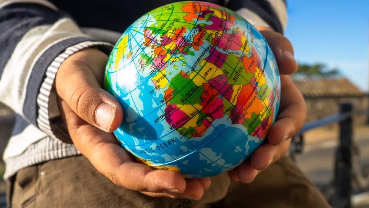 globe child world hands