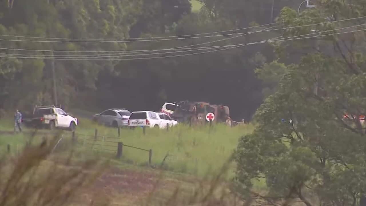 A screenshot captured from a 9 News broadcast shows several vehicles sitting along a country road.
