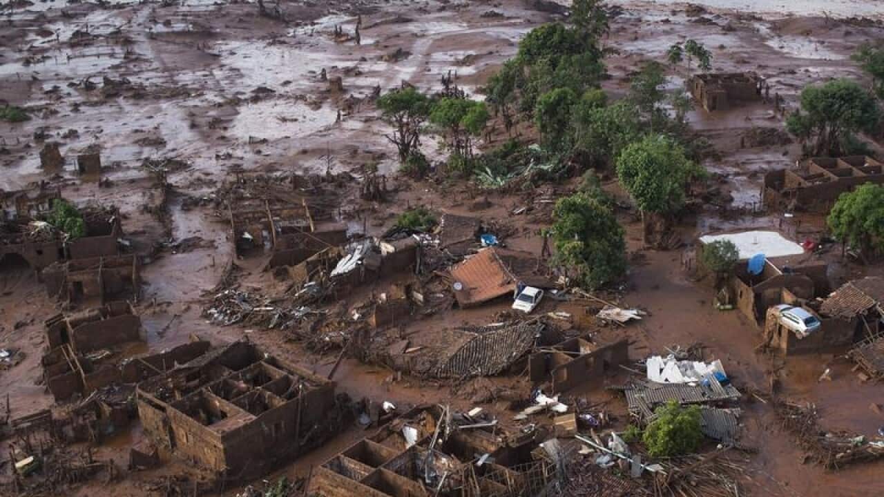 A file image of homes laying in ruins after mine dams burst in Brazil.
