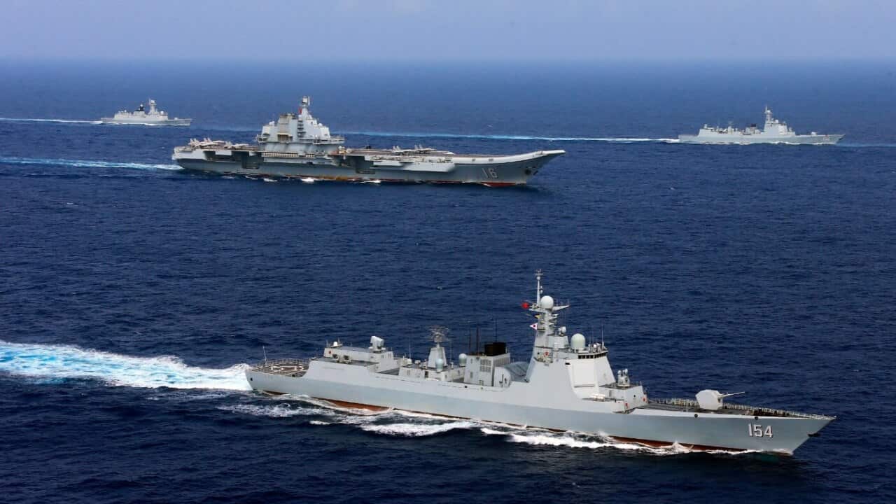 The fleet of the PLA (People's Liberation Army) Navy including China's aircraft carrier, The Liaoning, and destroyers and frigates sail during a naval exercise