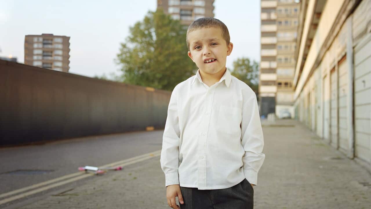 Boy on housing estate, portrait