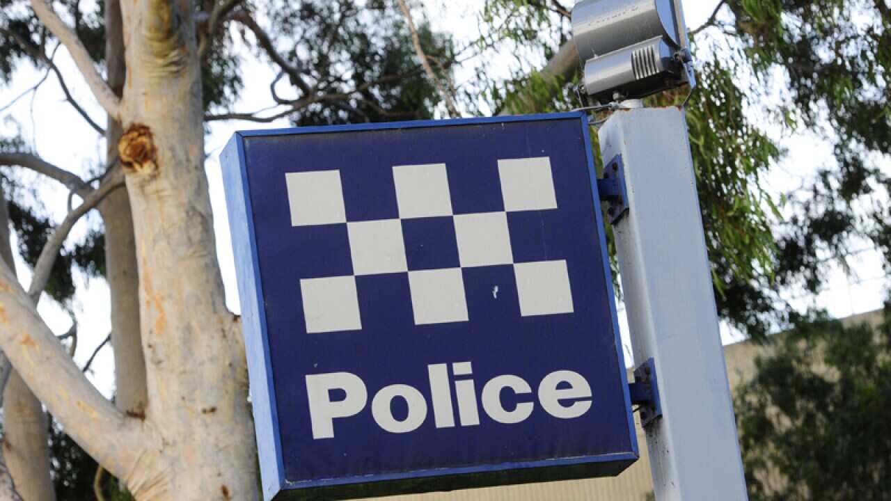 A stock image of a police sign