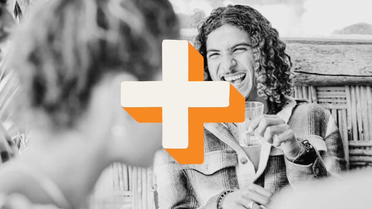 A man holds an empty drink