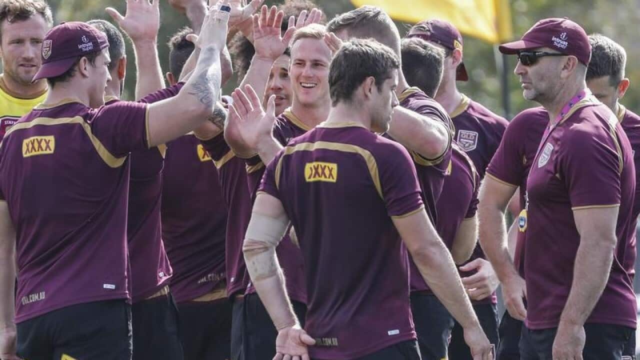 Queensland Maroons player Daly Cherry-Evans (C) is seen with teammates