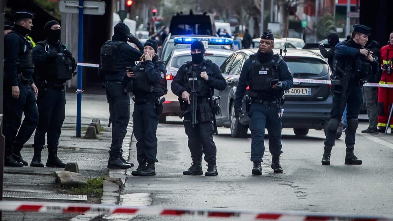 French police at a security perimeter at the Hautes-Bruyeres public park in Villejuif, near Paris.