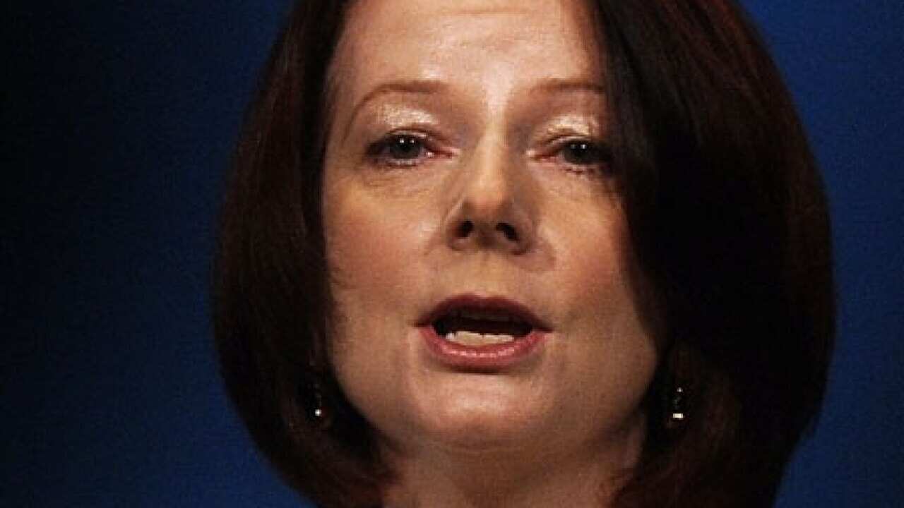 gillard_SuuKyiRelease_101114_B_getty_2037055165