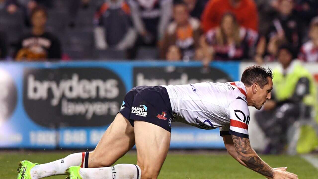 Mitchell Pearce of the Roosters scores a try