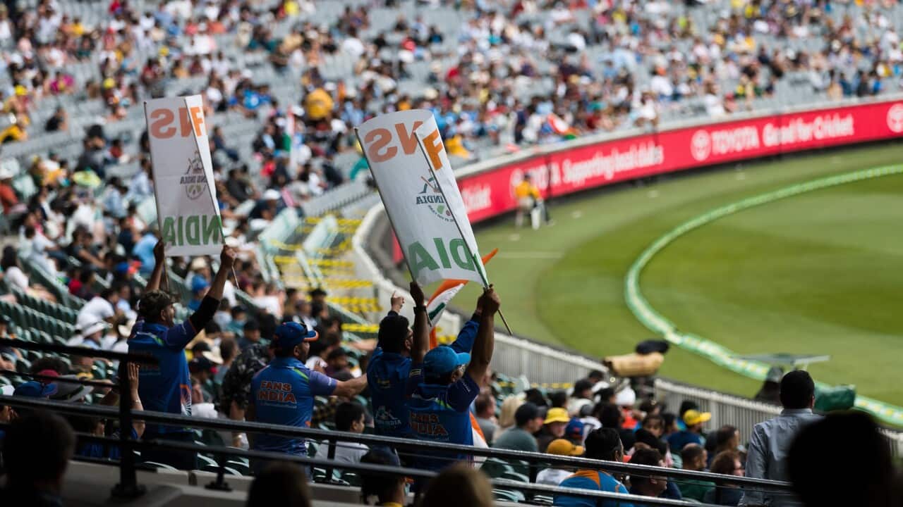 Fans flying flags and cheering during day two of the Test cricket match between Australia and India at the Melbourne Cricket Ground, 27 December, 2020