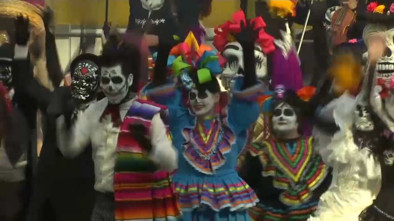 Mexican football fans held a Day of the Dead party in Moscow, but had to cancel a parade in Red Square. 