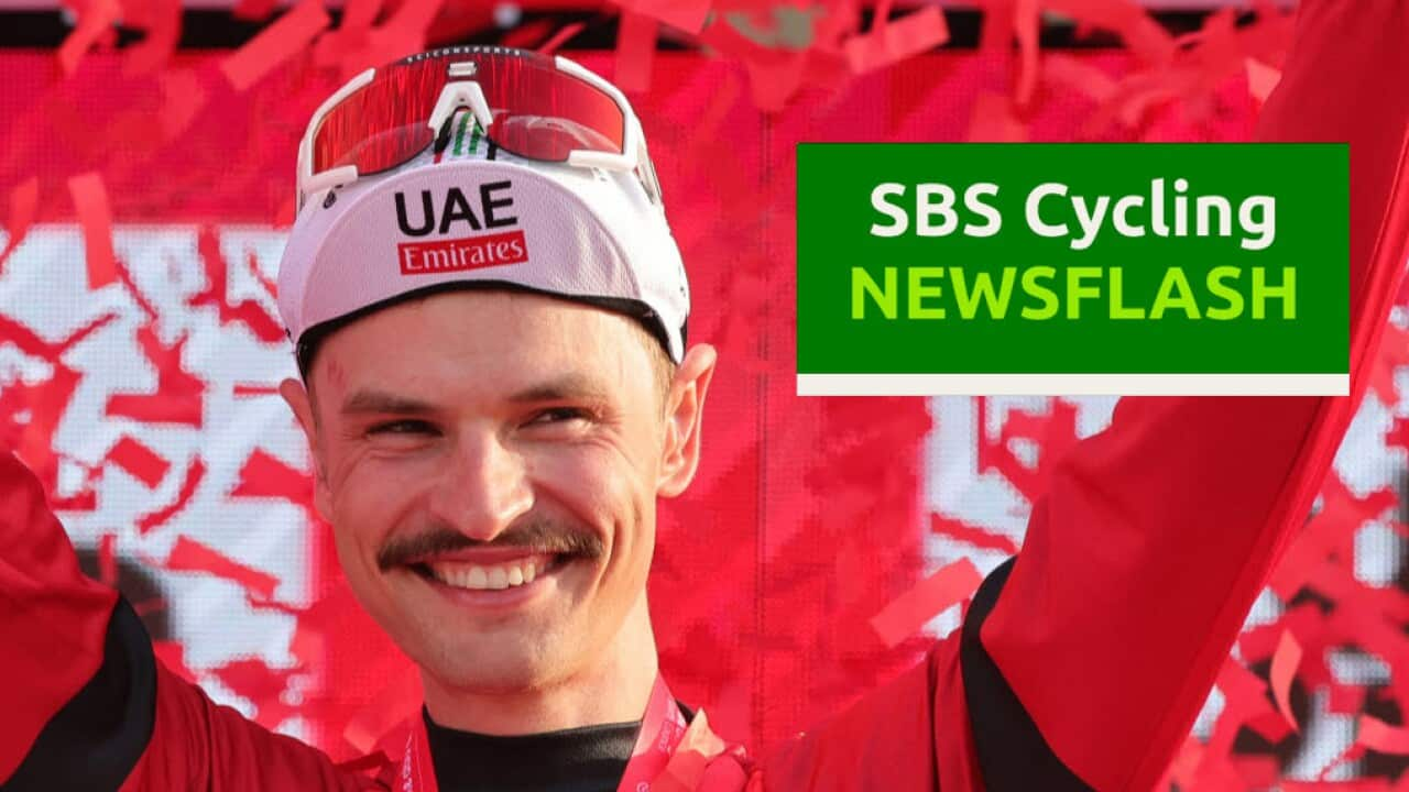 UAE Team Emirates' Australian cyclist Jay Vine celebrates being the leader of the race on the podium following stage 6 of the 6th UAE Cycling Tour from the Louvre Abu Dhabi to Abu Dhabi Breakwater on February 24, 2024. (Photo by Giuseppe CACACE / AFP) (Photo by GIUSEPPE CACACE/AFP via Getty Images)