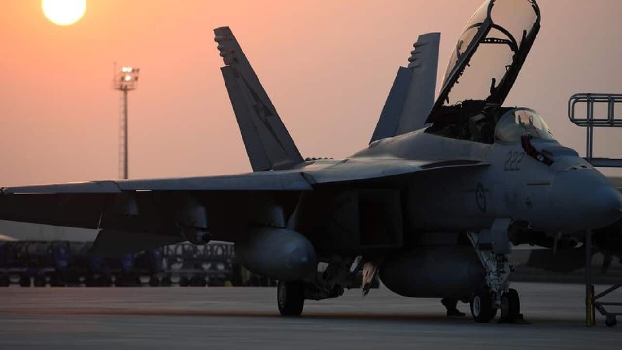 A Pilot makes final checks on a RAAF Super Hornet.