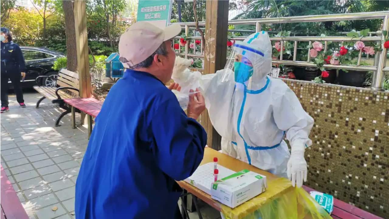Officials in Shanghai have confirmed the first death in the city's COVID-19 outbreak, which has resulted strict lockdowns, and compulsory testing.