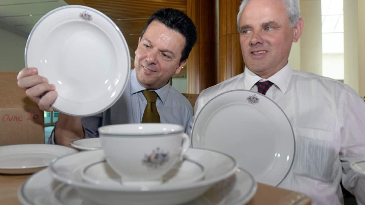 Senators Nick Xenophon (L) and John Madigan pose for photos